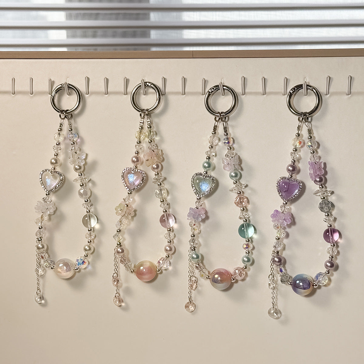 Decorative beaded phone chains with heart and flower charms