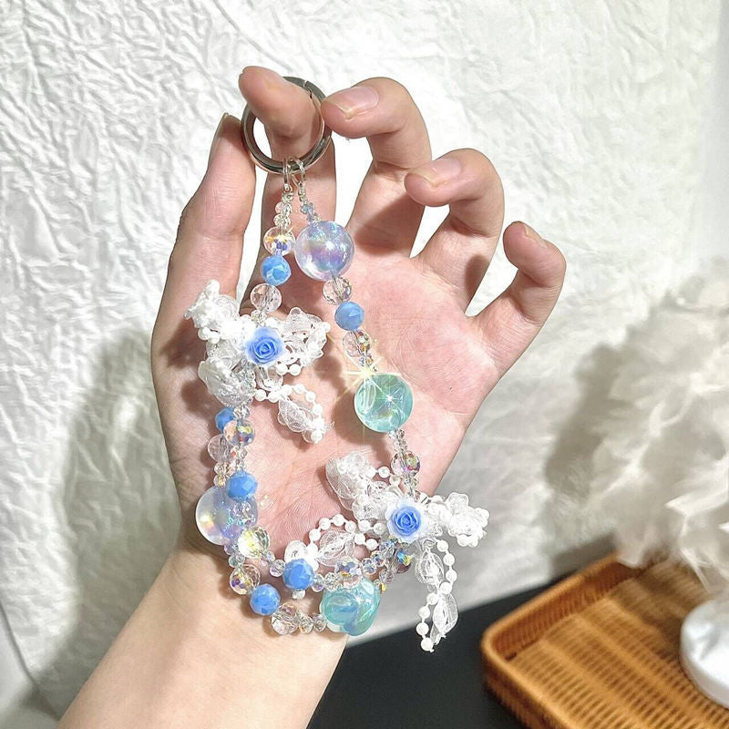 Blue and white beaded phone chain with floral charms