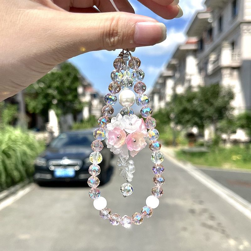 Pink floral beaded phone strap with pearl-style beads